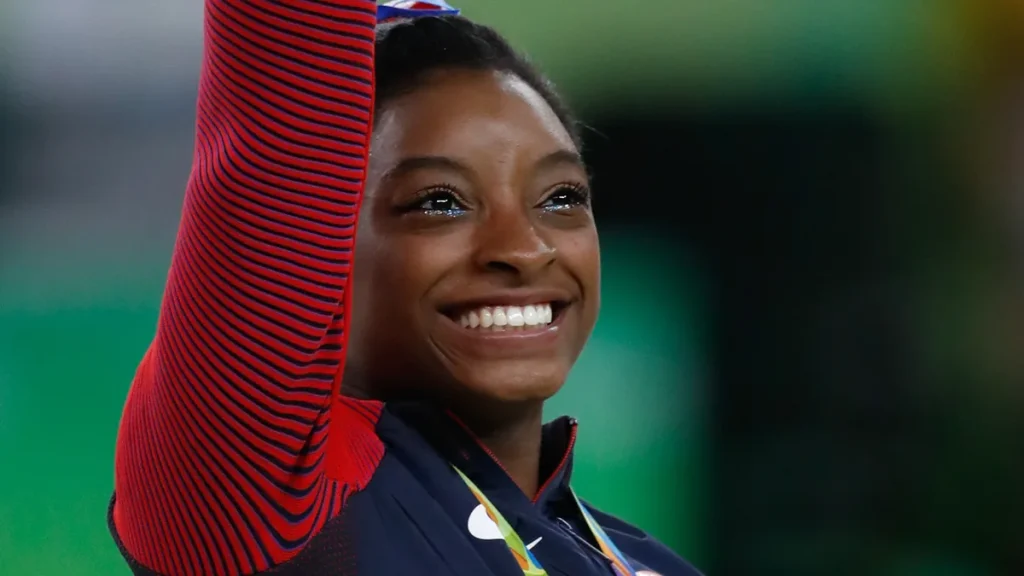 Simone Biles — photo via Wikimedia Commons, CC BY 4.0 by MollySVH.