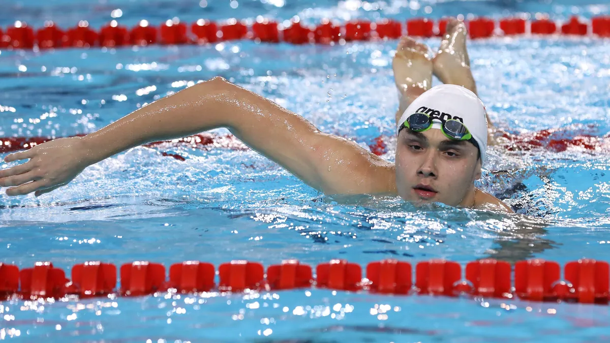 Competitive swim stroke — race pool.