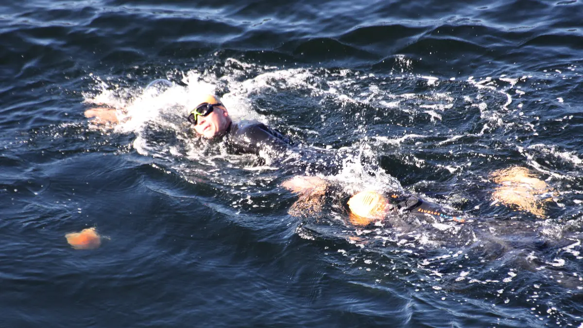Triathlon racing — multi-discipline endurance.