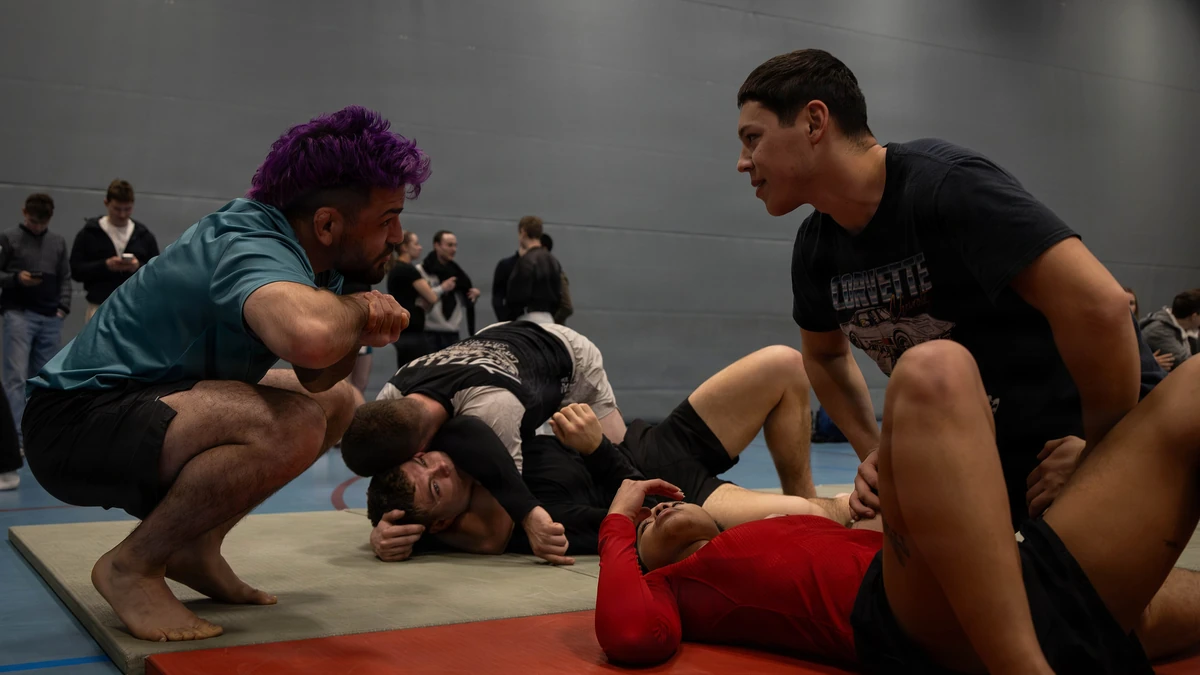 MMA training match — striking and ground.