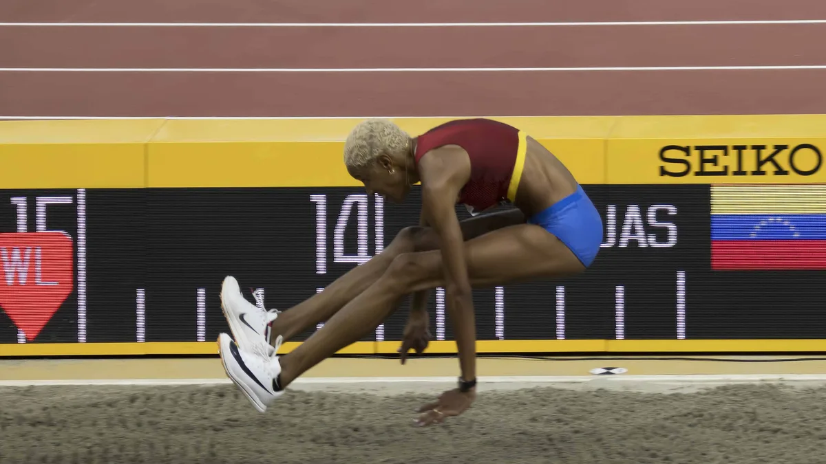 Triple jump — landing phase in the pit.