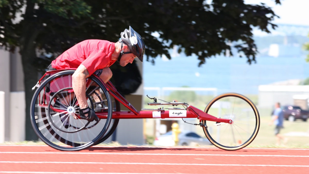 Wheelchair racing — sustained push cadence.